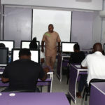 cvit nigeria class with computers with students and an instructure