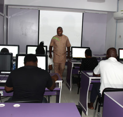 cvit nigeria class with computers with students and an instructure