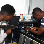 cvit nigeria training center and students working on a networking project